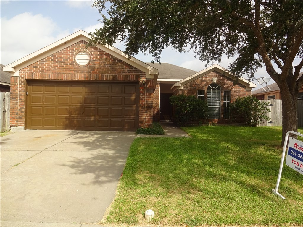 Undisclosed Address Corpus Christi, TX 78414 - Photo 1 of 16 a front view of a house with garden
