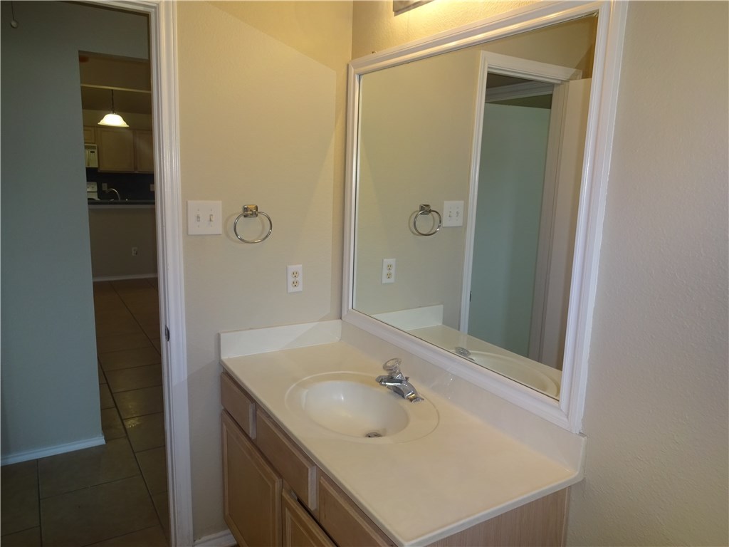 Undisclosed Address Corpus Christi, TX 78414 - Photo 16 of 16 a bathroom with a sink and a mirror