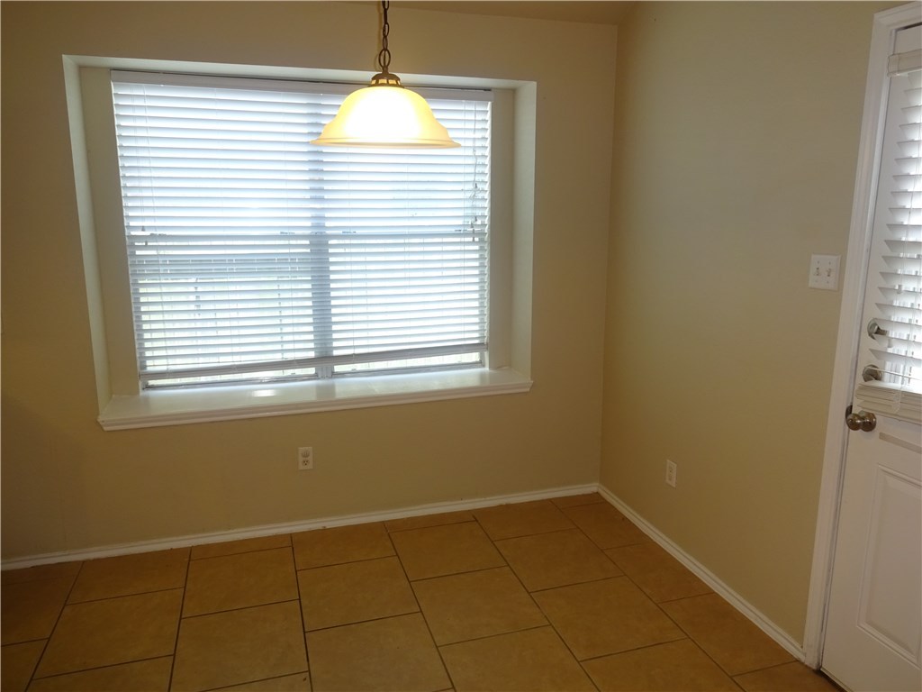Undisclosed Address Corpus Christi, TX 78414 - Photo 4 of 16 a view of an empty room with a window