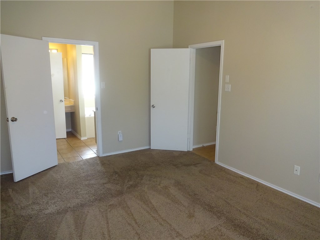 Undisclosed Address Corpus Christi, TX 78414 - Photo 9 of 16 a view of an empty room with closet and a window