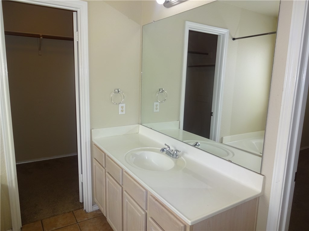 Undisclosed Address Corpus Christi, TX 78414 - Photo 10 of 16 a bathroom with a sink and a mirror