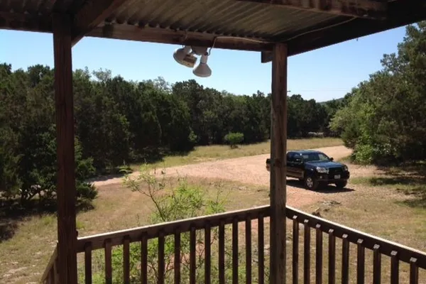 a view of a small yard from a balcony