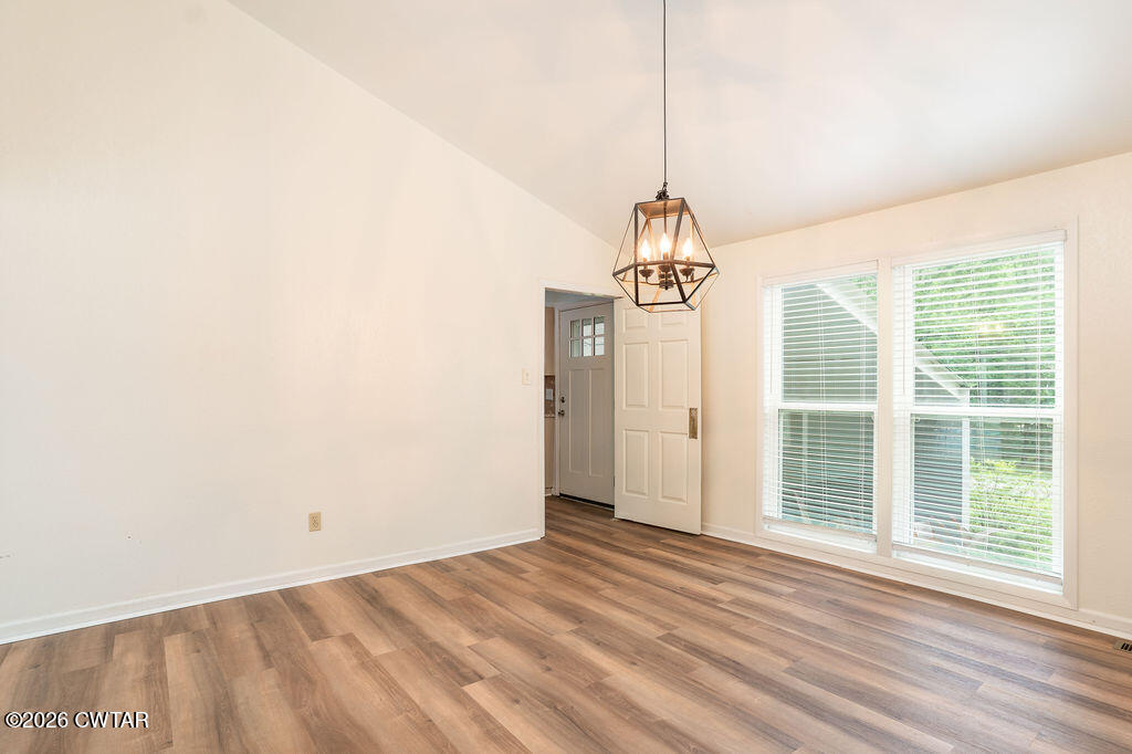 7 Timberlake Drive Jackson, TN 38305 - Photo 5 of 38 a view of empty room with wooden floor and fan