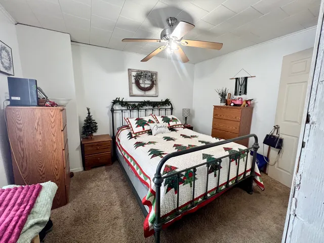 a bedroom with a bed and a table in it