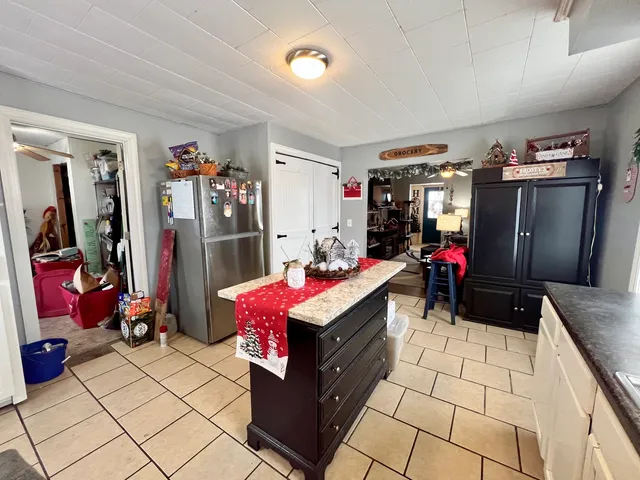 a living room with a couch and a potted plant