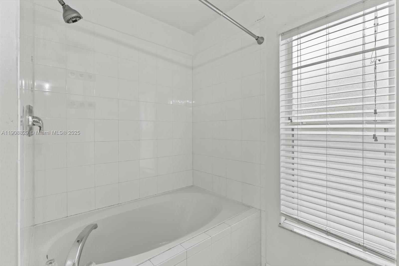 1392 Southwest Sudder Avenue Port St. Lucie, FL 34953 - Photo 15 of 30 a close up of a bathtub curtain