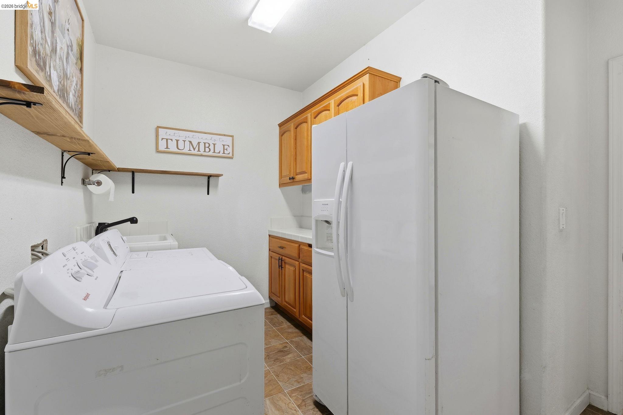 3438 Keystone Loop Discovery Bay, CA 94505 - Photo 40 of 57 a utility room with dryer and washer