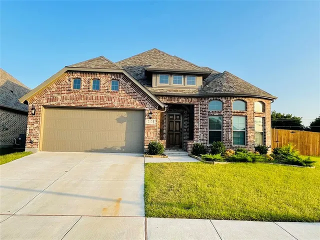 a front view of a house with yard outdoor seating and barbeque oven