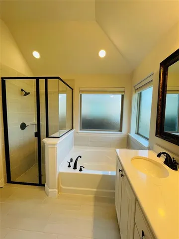 a bathroom with a bathtub and a sink