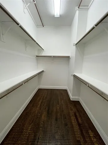 a view of an empty walk in closet