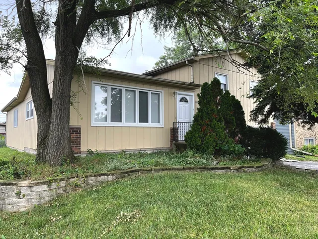 front view of a house with a yard