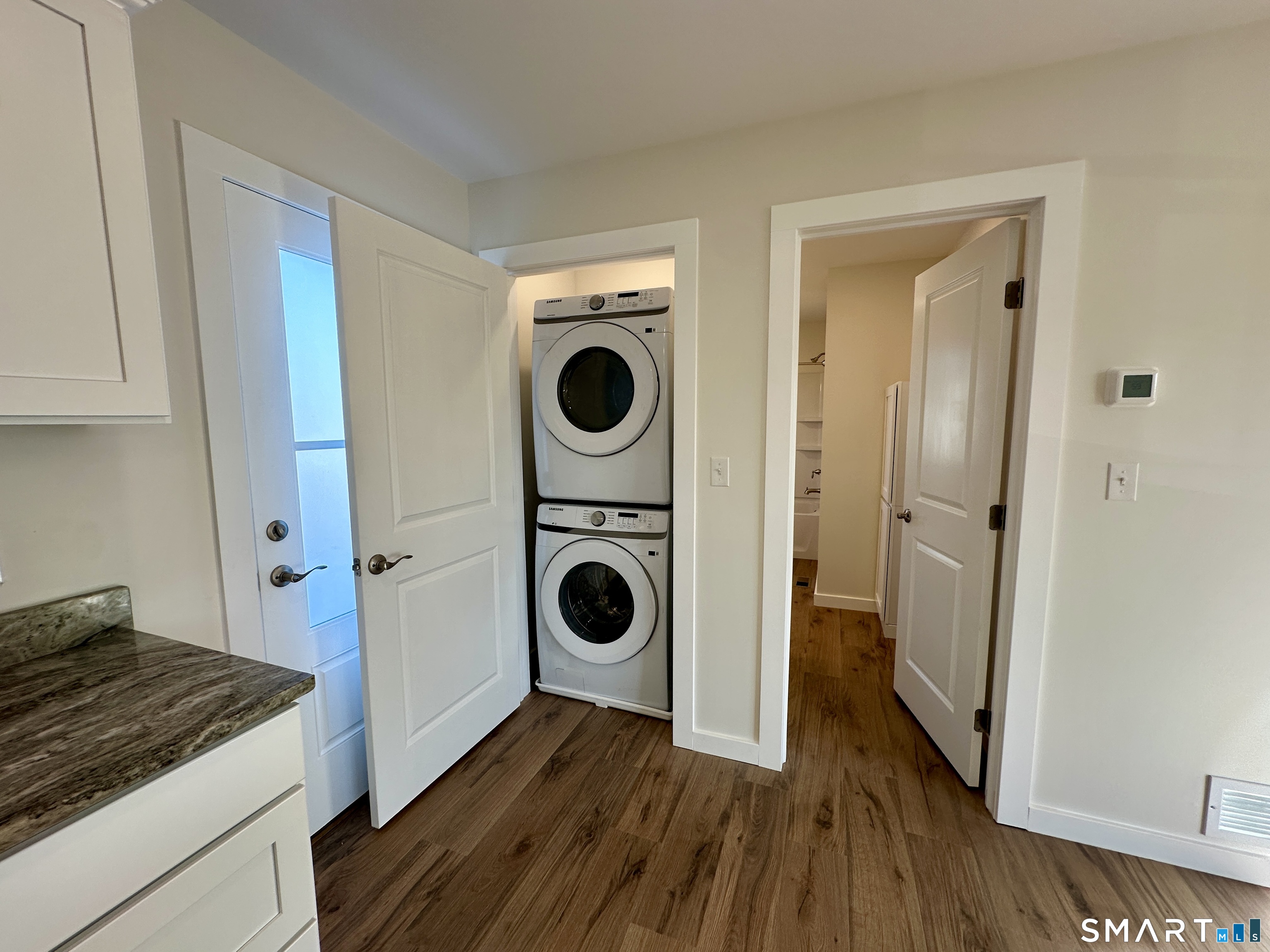 48 Cedar Street, Unit D Branford, CT 06405 - Photo 15 of 27 a view of a storage and utility room with washer and dryer