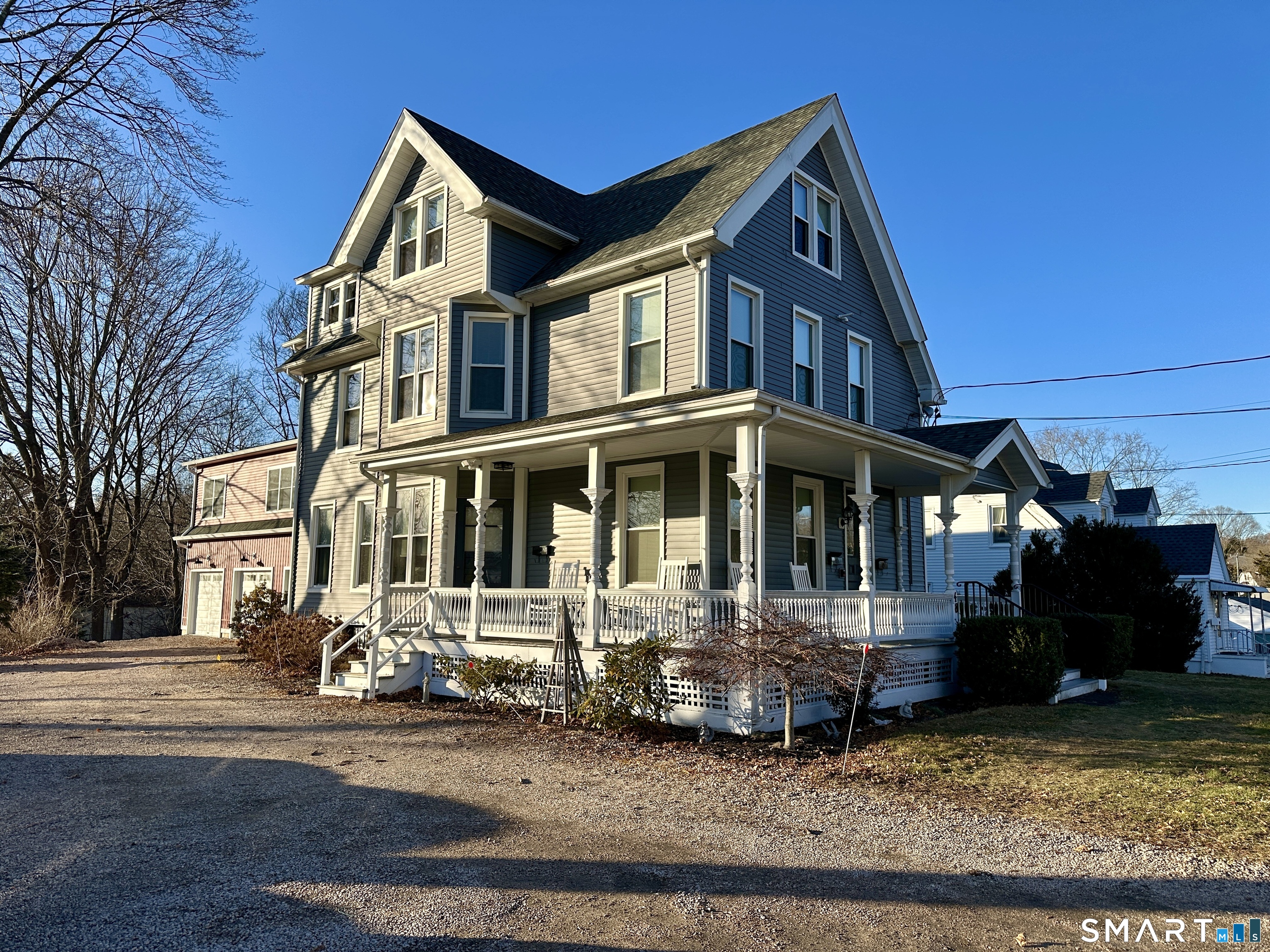 48 Cedar Street, Unit D Branford, CT 06405 - Photo 4 of 27 a front view of a house with a yard