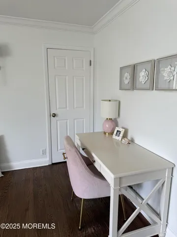 a view of a room that has a table and chairs in it