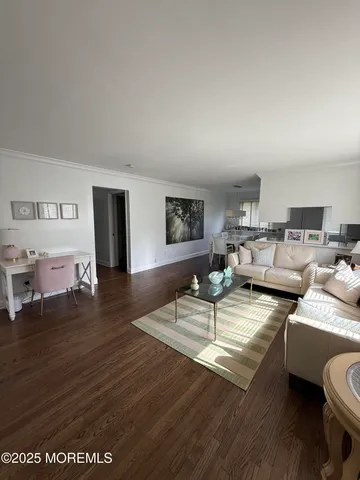 a view of a living room and dining room