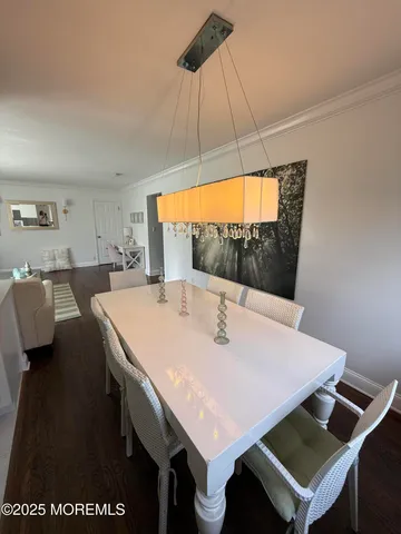 a view of kitchen with a table and chairs