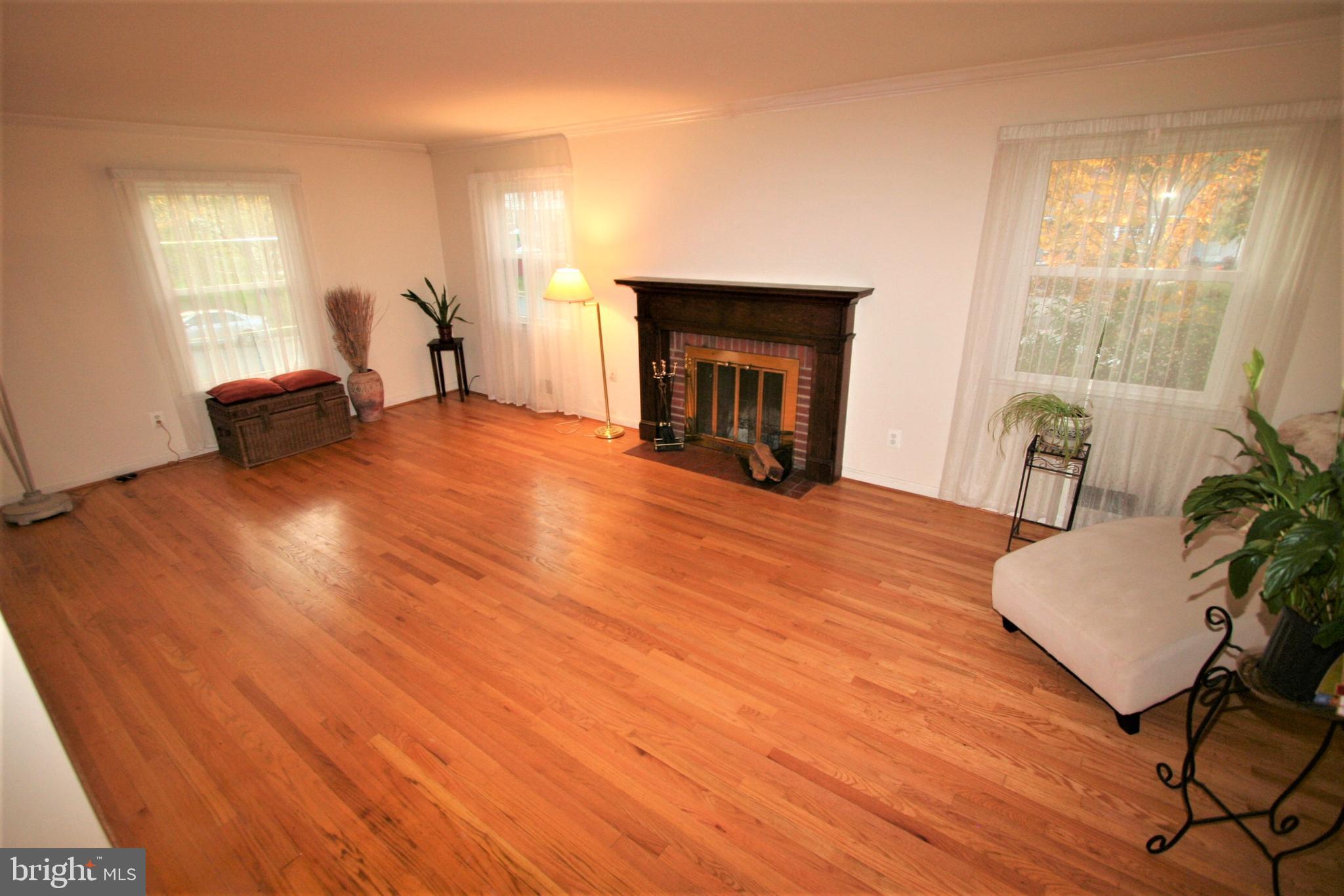 10405 Kinloch Road Silver Spring, MD 20903 - Photo 9 of 38 Living Room with wood burning Fireplace