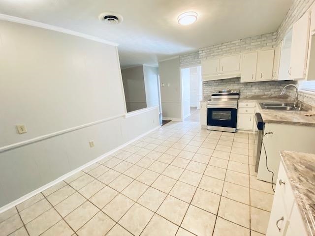 1867 Dearing Road Memphis, TN 38117 - Photo 3 of 25 a kitchen with stainless steel appliances cabinets a sink and a stove top oven