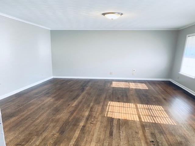 1867 Dearing Road Memphis, TN 38117 - Photo 5 of 25 an empty room with wooden floor