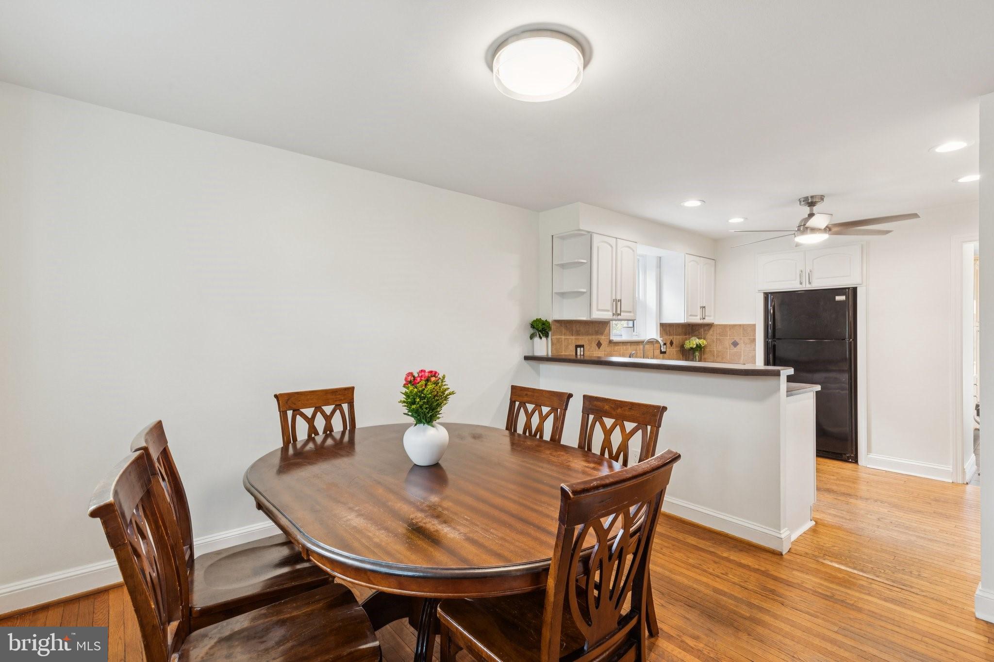 222 Harrogate Road Wynnewood, PA 19096 - Photo 11 of 43 a view of a dining room with furniture and wooden floor