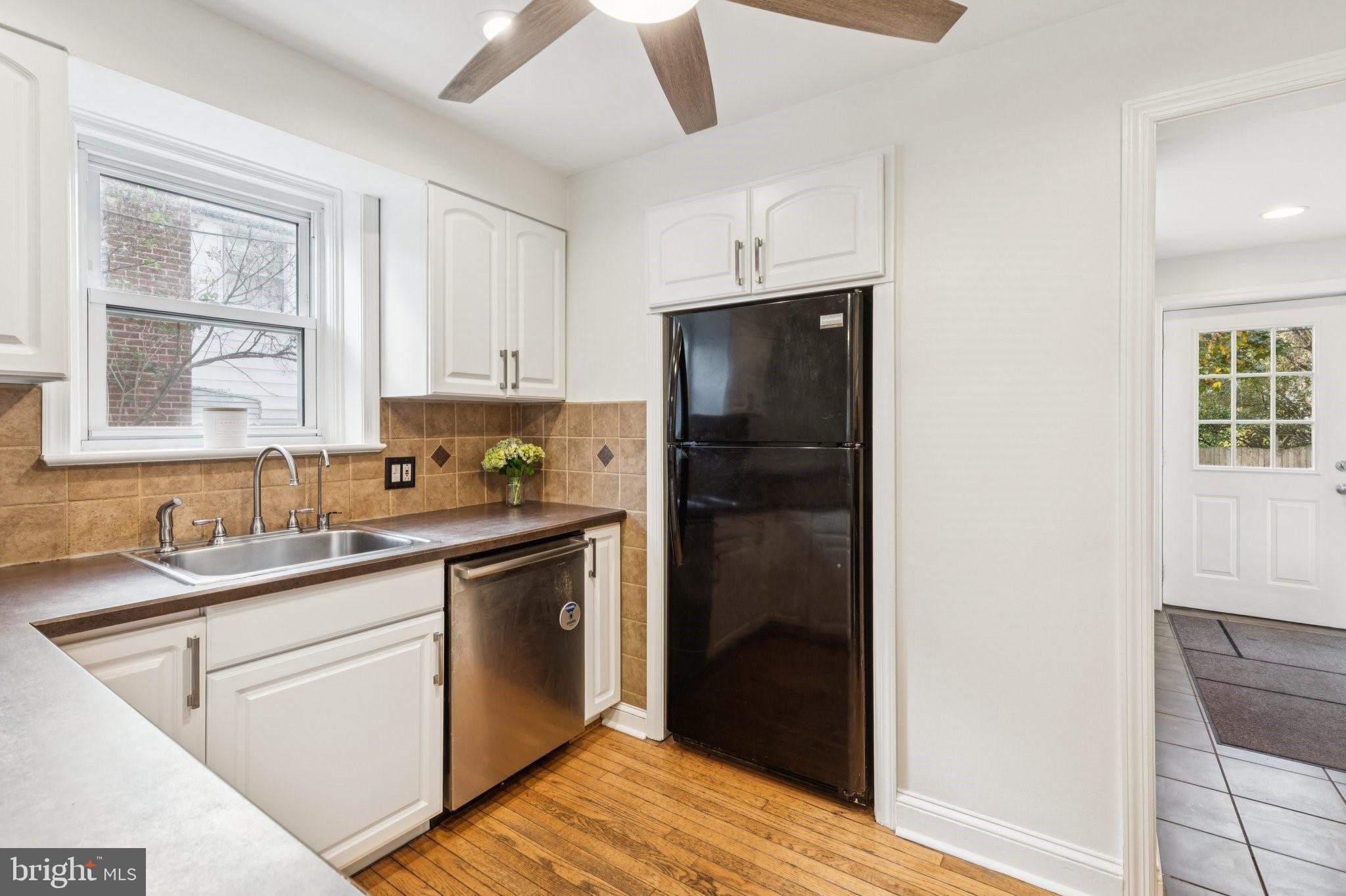 222 Harrogate Road Wynnewood, PA 19096 - Photo 13 of 43 a kitchen with a sink and refrigerator
