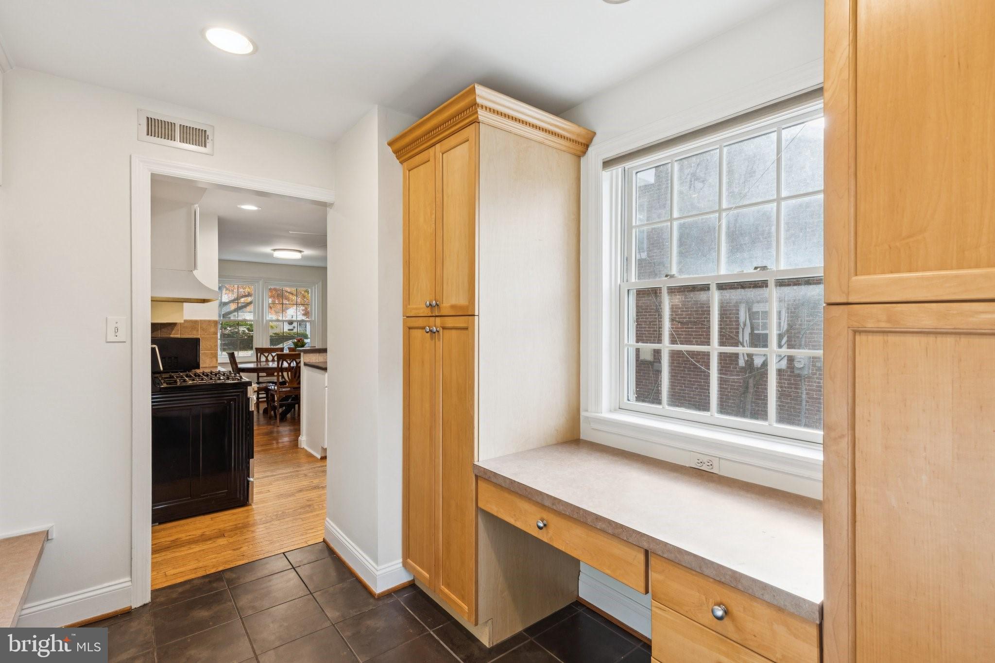 222 Harrogate Road Wynnewood, PA 19096 - Photo 18 of 43 a kitchen with a refrigerator and a stove