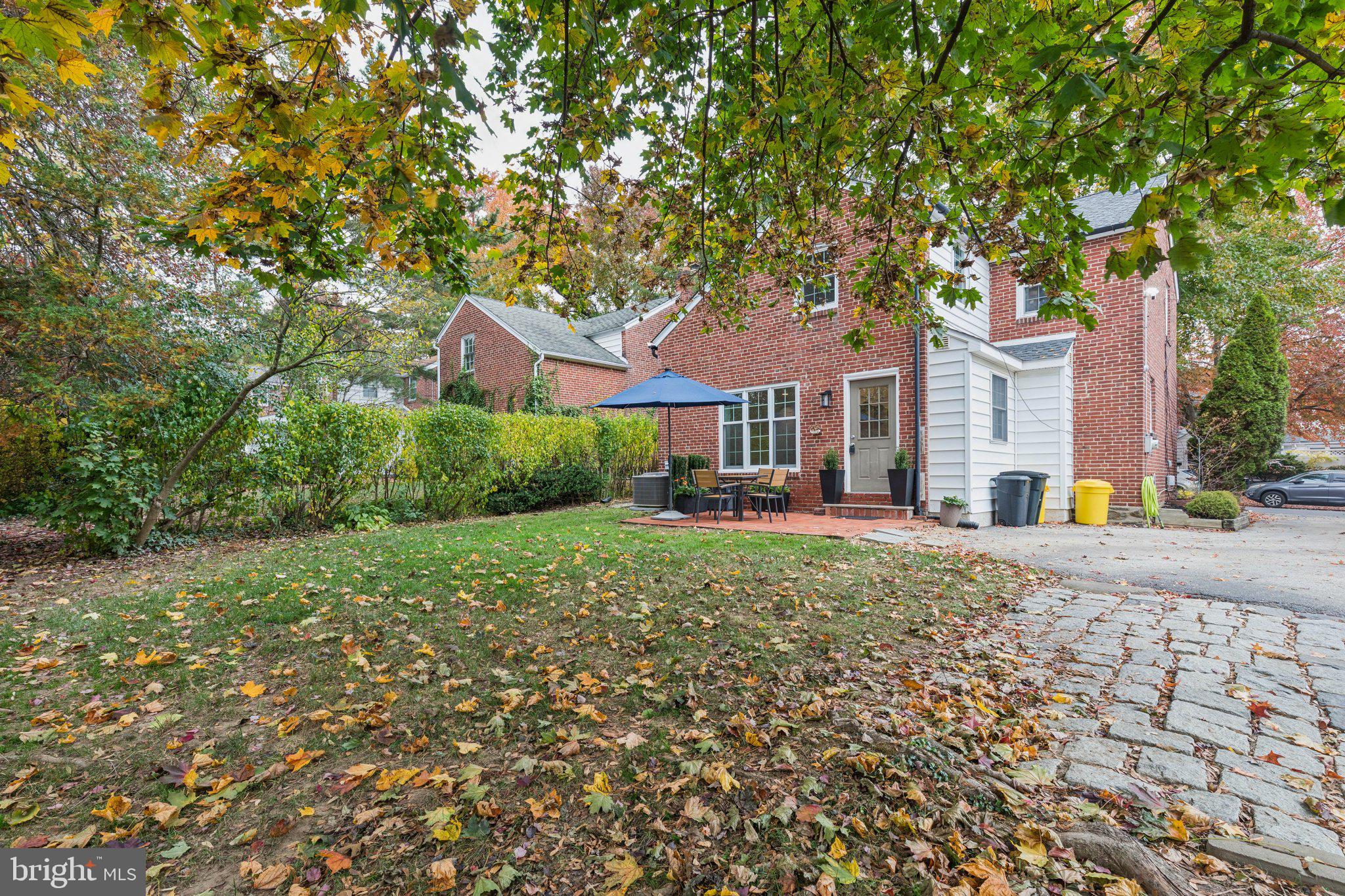 222 Harrogate Road Wynnewood, PA 19096 - Photo 23 of 43 a front view of a house with a yard and trees