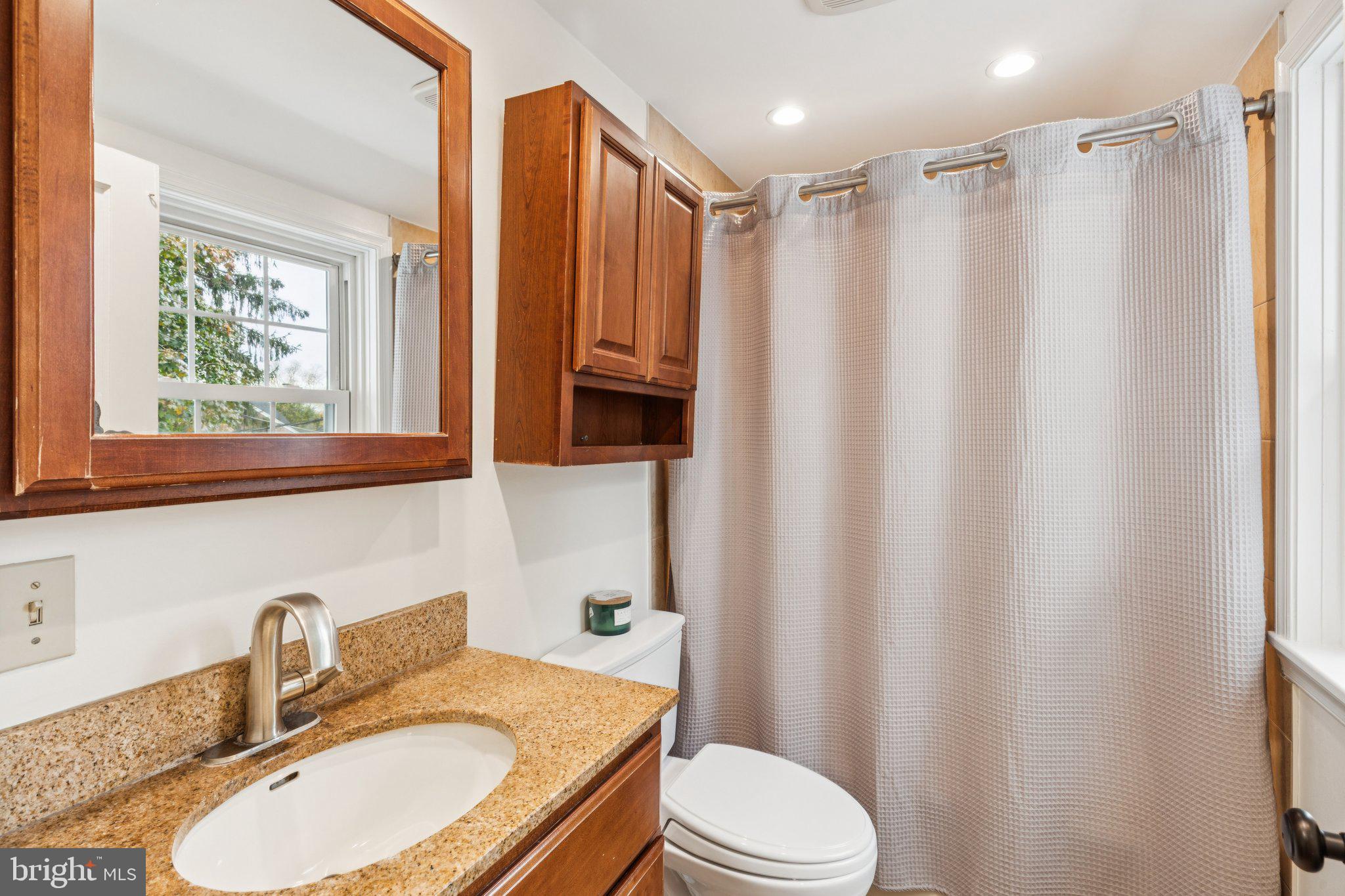 222 Harrogate Road Wynnewood, PA 19096 - Photo 24 of 43 a bathroom with a granite countertop sink toilet and shower