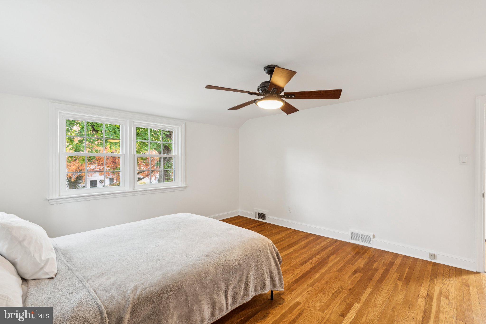 222 Harrogate Road Wynnewood, PA 19096 - Photo 27 of 43 a bedroom with a bed and a window