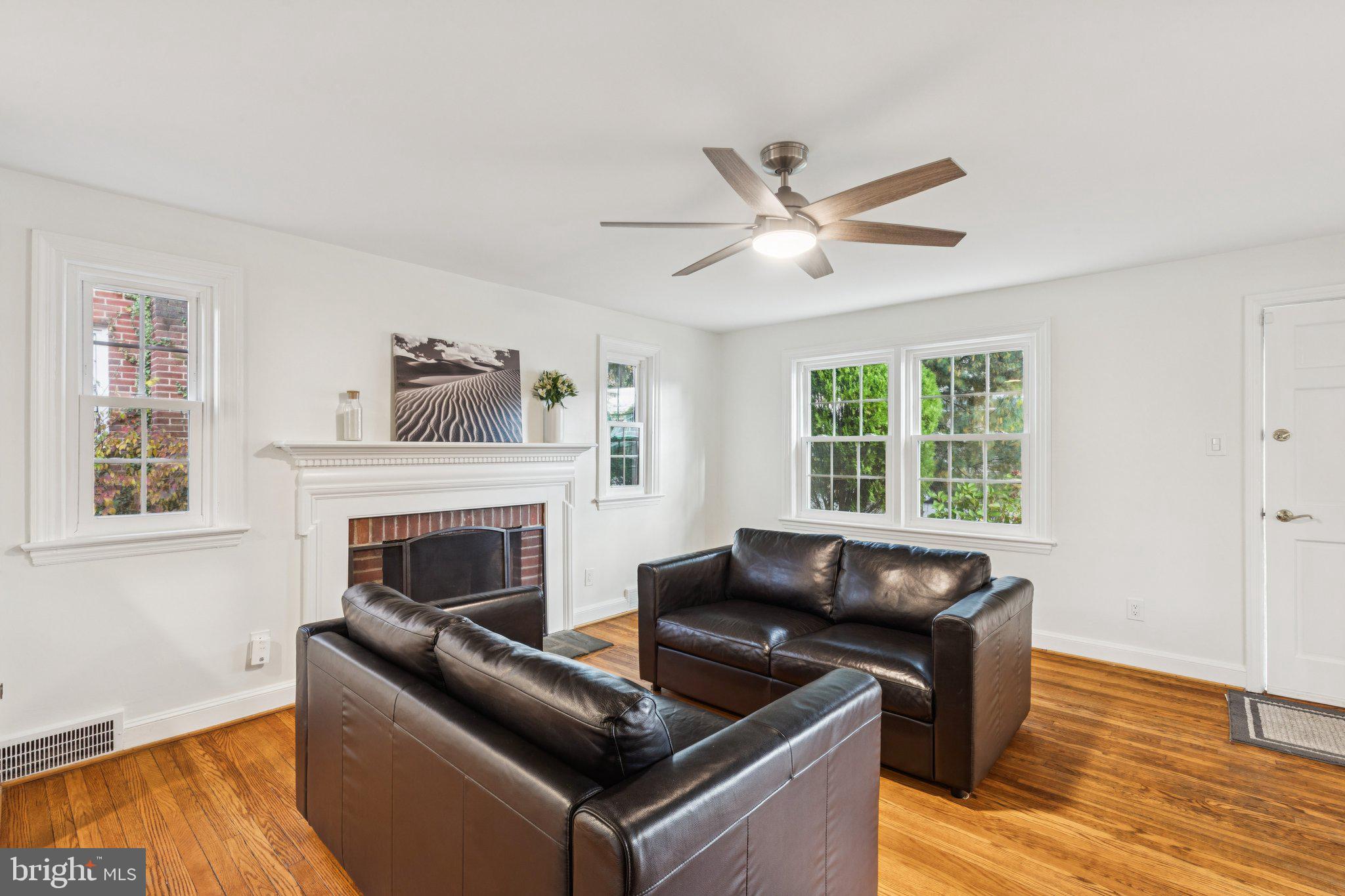222 Harrogate Road Wynnewood, PA 19096 - Photo 4 of 43 a living room with furniture and a fireplace