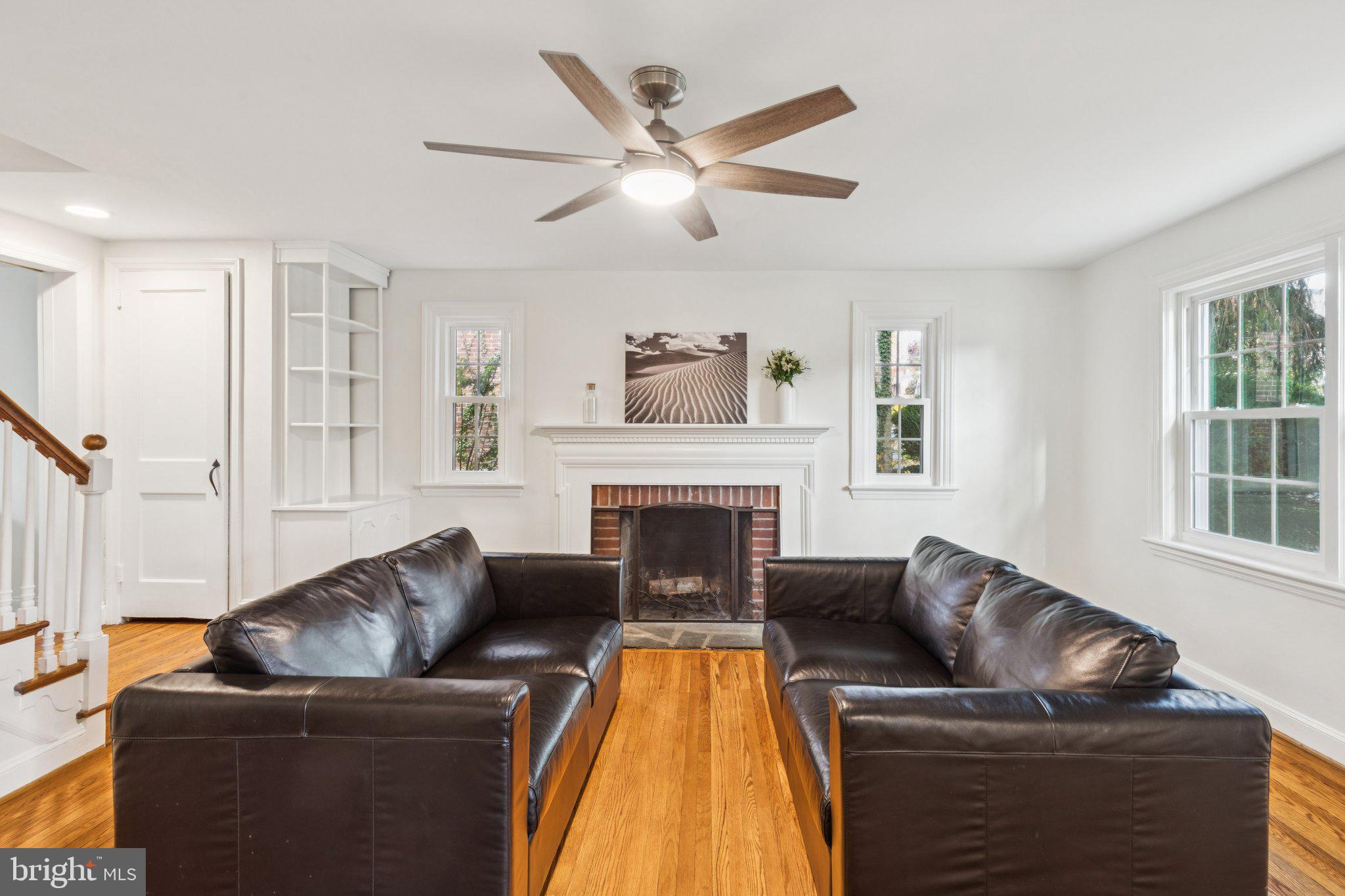 222 Harrogate Road Wynnewood, PA 19096 - Photo 6 of 43 a living room with furniture and a fireplace