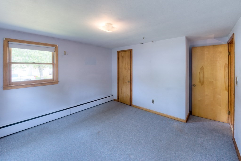 50 Upton Street Springfield, MA 01104 - Photo 17 of 36 an empty room with a window