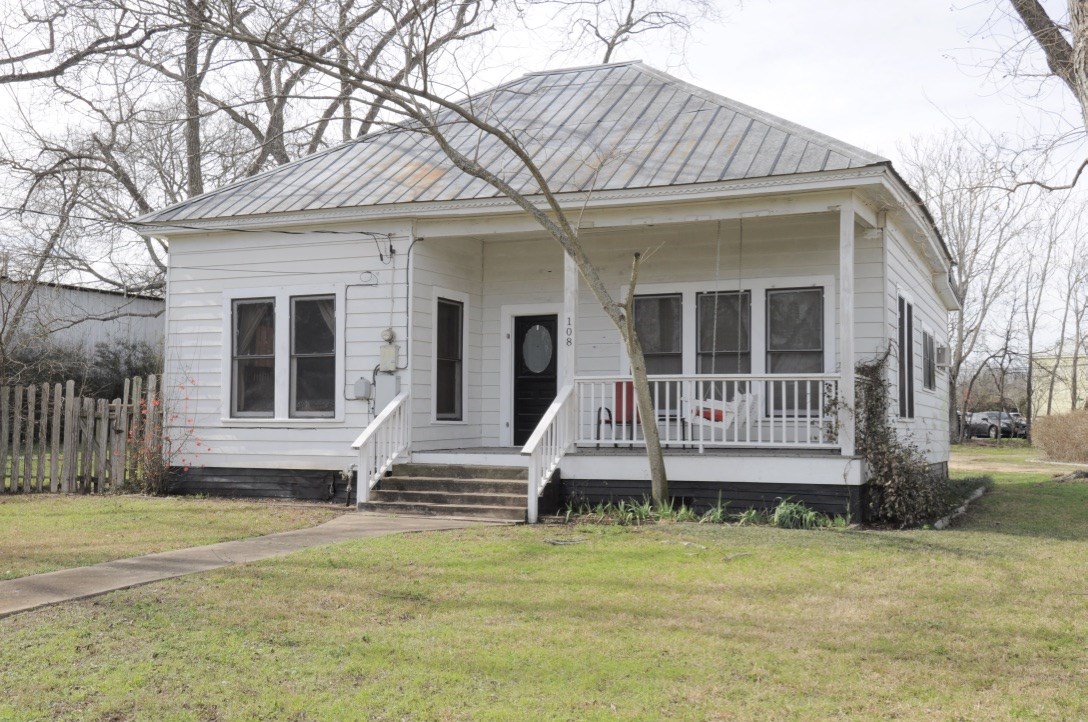 108 Lilly Street Buda, TX 78610 - Photo 1 of 1 a front view of a house with a yard