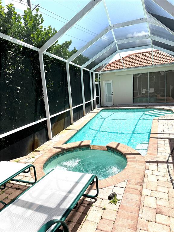 8870 Huntington Pointe Drive Sarasota, FL 34238 - Photo 20 of 28 a view of swimming pool with a lounge chair
