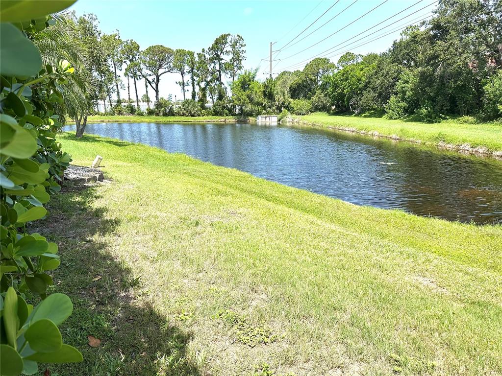 8870 Huntington Pointe Drive Sarasota, FL 34238 - Photo 21 of 28 a view of a lake with houses