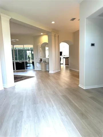 a view of a livingroom with furniture wooden floor and window