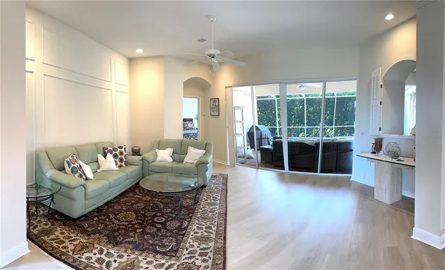 a living room with furniture and a large window