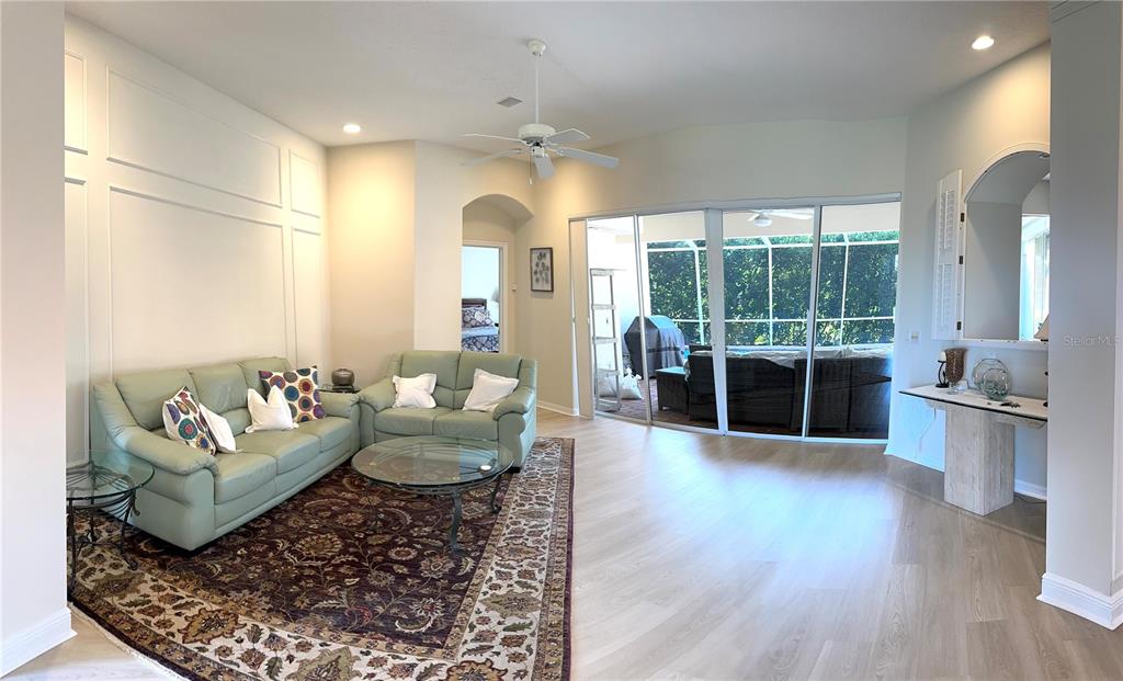 8870 Huntington Pointe Drive Sarasota, FL 34238 - Photo 4 of 28 a living room with furniture and a large window