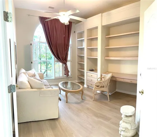 a living room with furniture a window and a bathtub