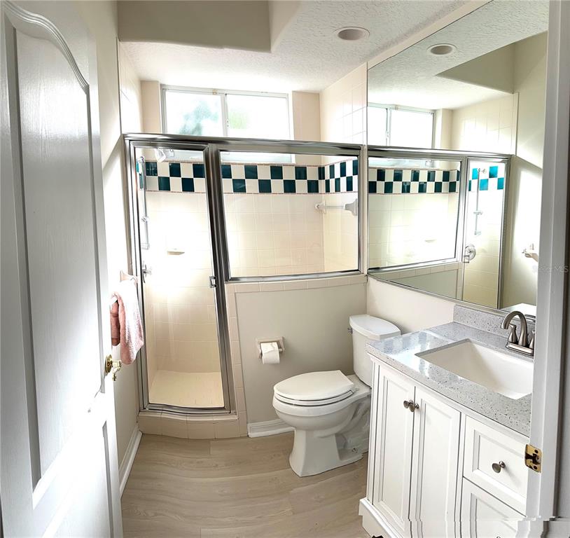8870 Huntington Pointe Drive Sarasota, FL 34238 - Photo 8 of 28 a bathroom with a sink and a mirror