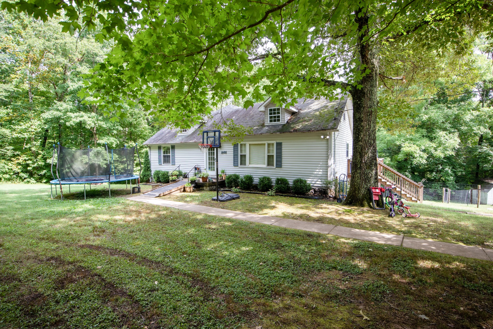 1095 Porter Road Burns, TN 37029 - Photo 1 of 34 a view of a house with yard and sitting area