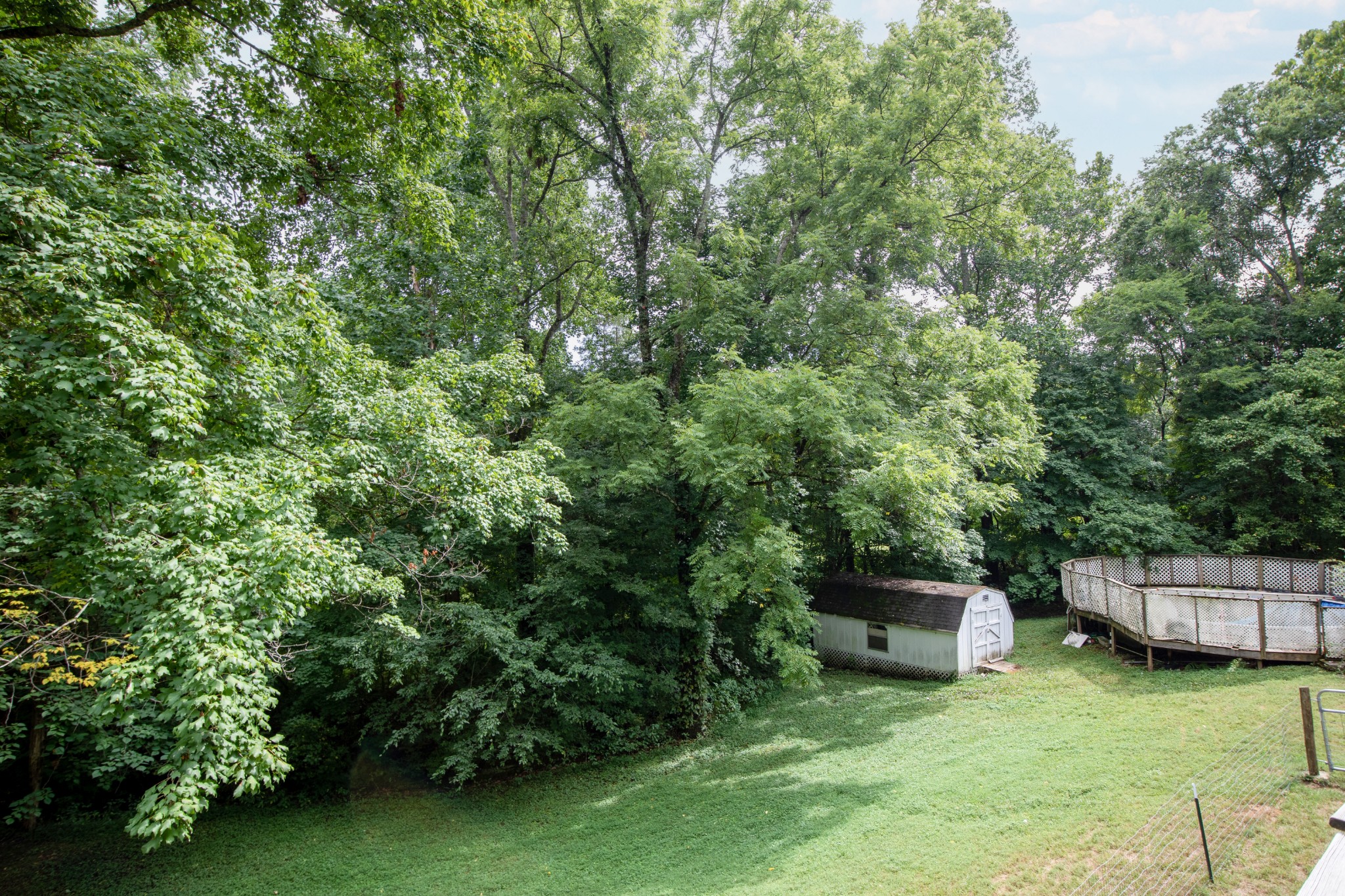 1095 Porter Road Burns, TN 37029 - Photo 26 of 34 a backyard of a house with chairs and a table