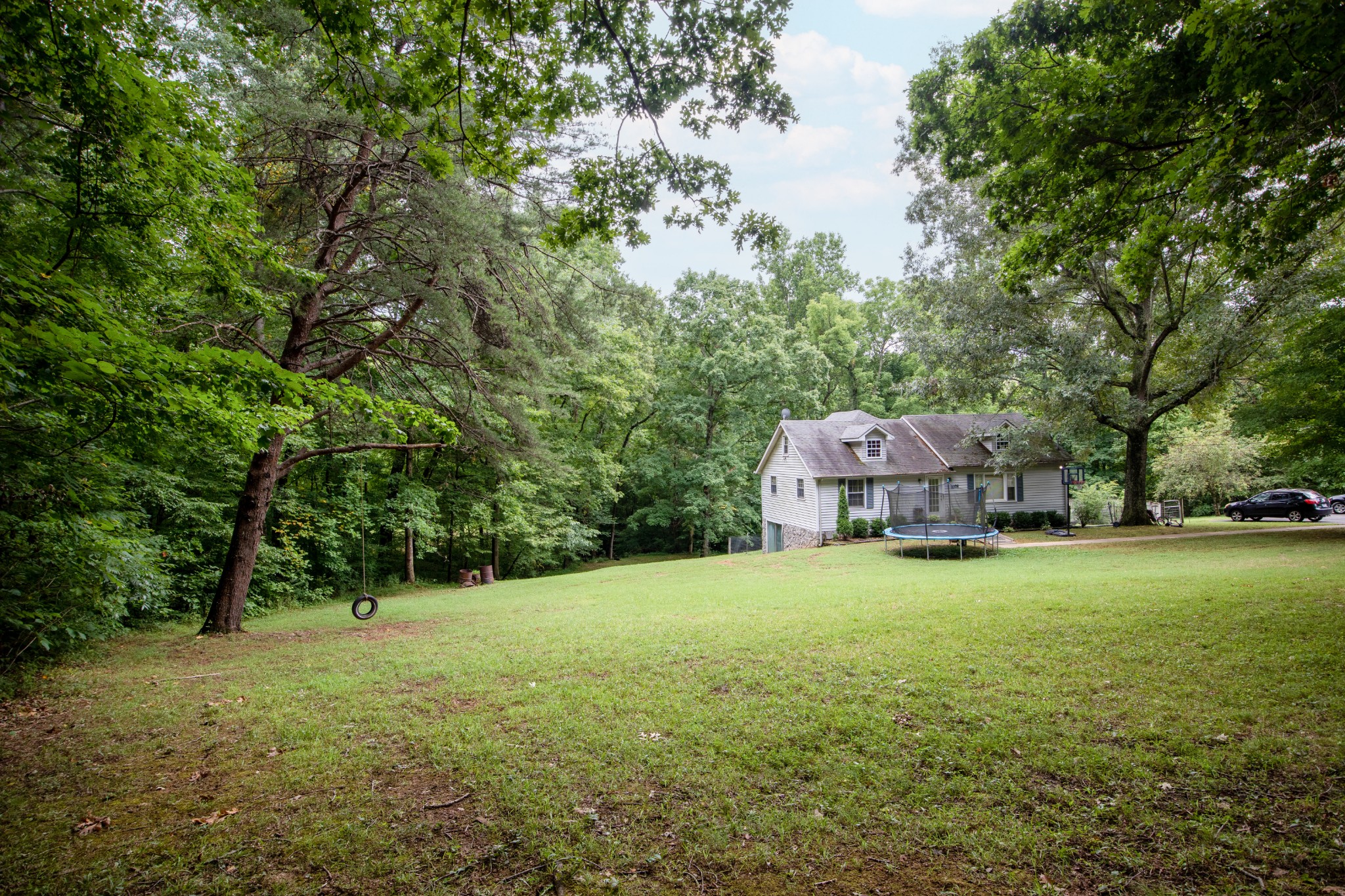 1095 Porter Road Burns, TN 37029 - Photo 29 of 34 a view of a large garden with plants and large trees