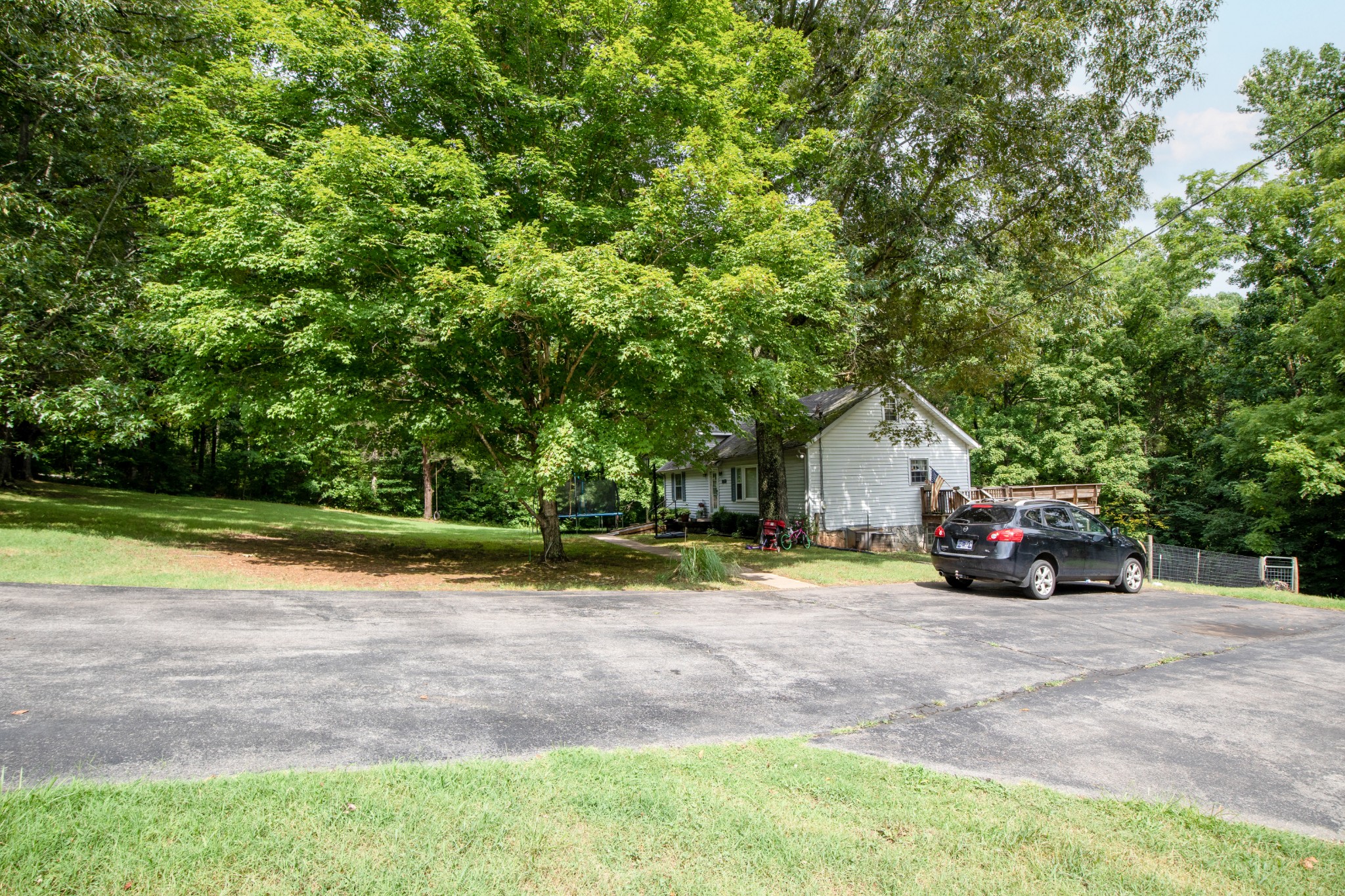 1095 Porter Road Burns, TN 37029 - Photo 30 of 34 a view of road with house and trees in the background