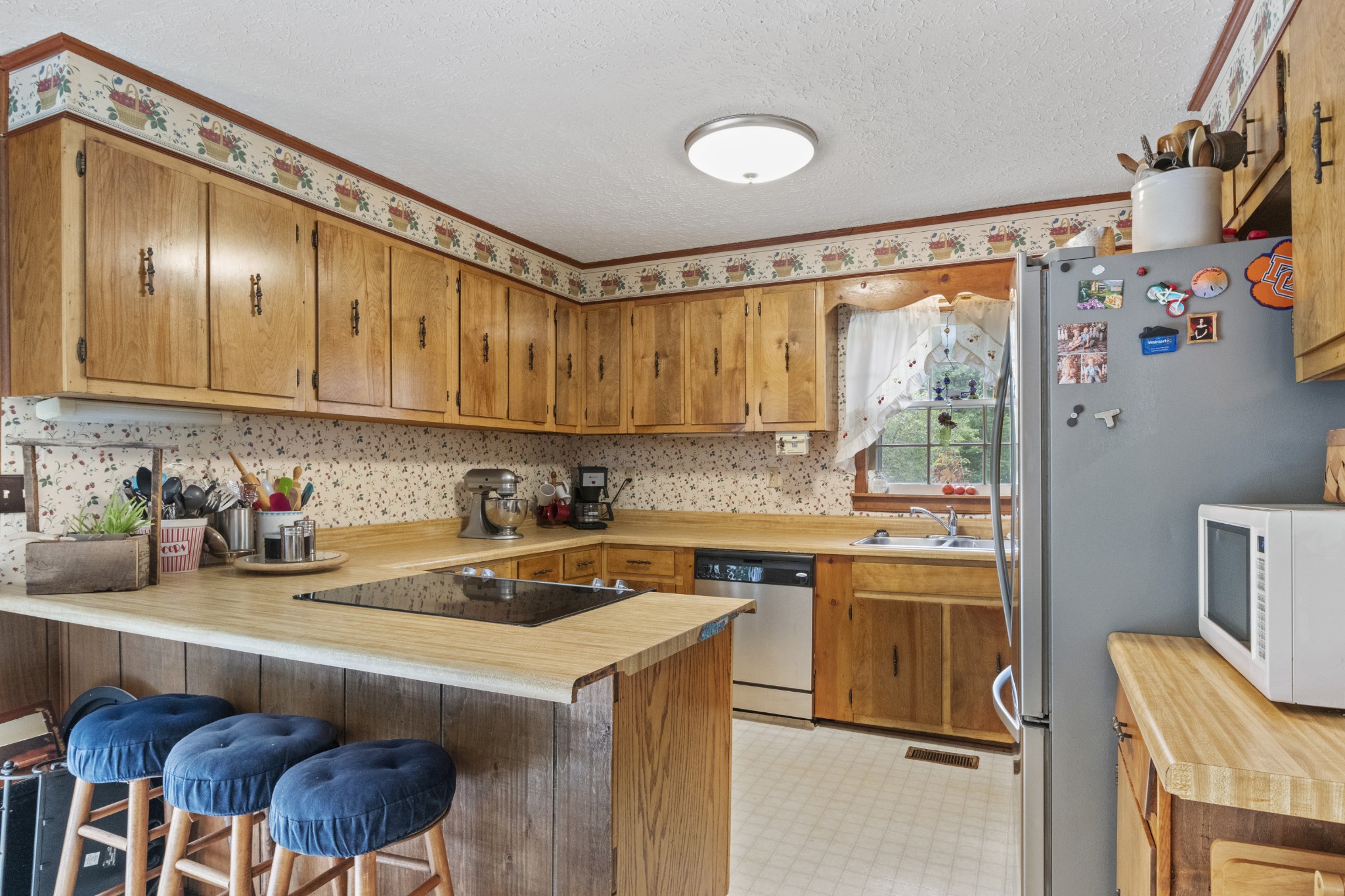 1095 Porter Road Burns, TN 37029 - Photo 3 of 34 a kitchen with a sink a stove and a refrigerator