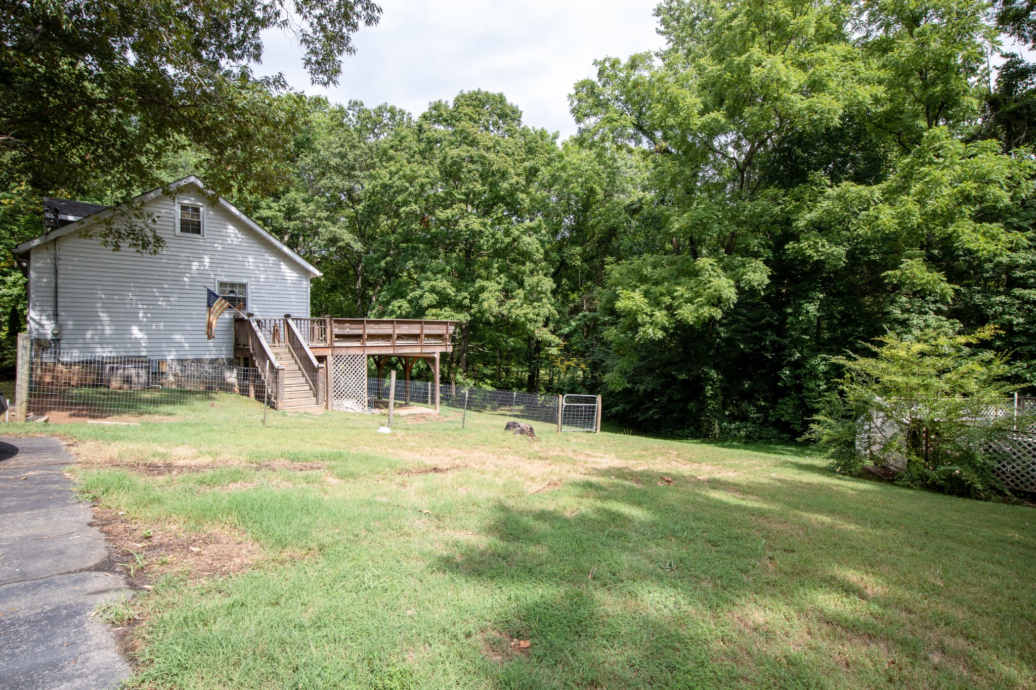 1095 Porter Road Burns, TN 37029 - Photo 31 of 34 a backyard of a house with lots of green space