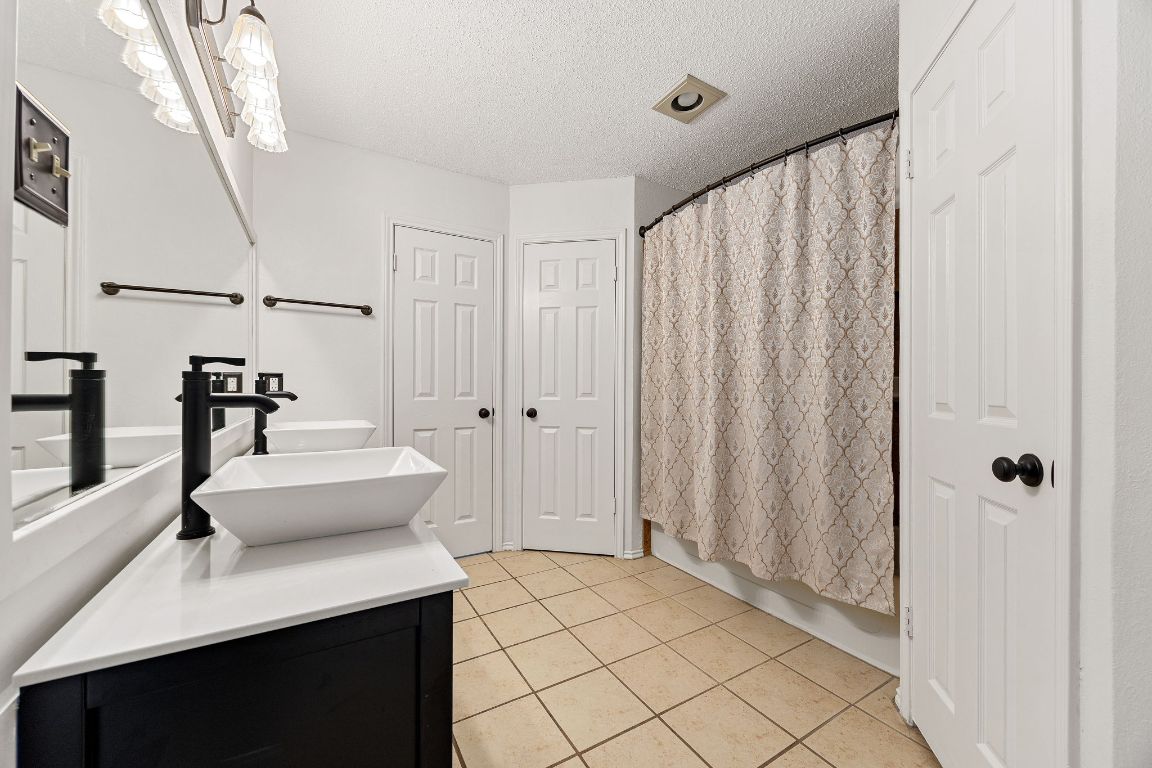 2602 Armstrong Drive Leander, TX 78641 - Photo 11 of 22 a spacious bathroom with a shower and a sink