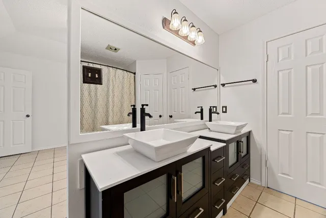 a kitchen with a sink and a refrigerator