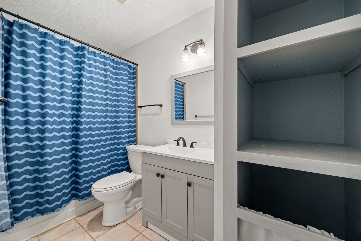2602 Armstrong Drive Leander, TX 78641 - Photo 17 of 22 a bathroom with a sink and a toilet