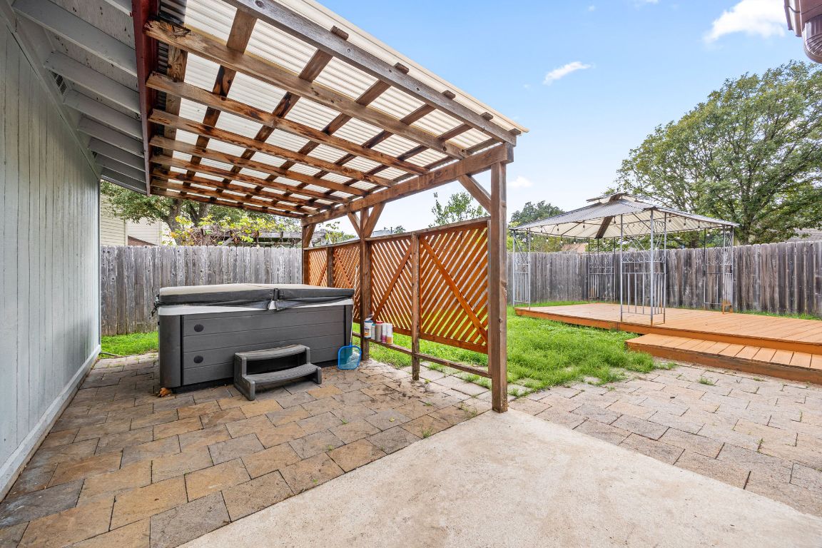 2602 Armstrong Drive Leander, TX 78641 - Photo 20 of 22 a backyard of a house with barbeque oven table and chairs